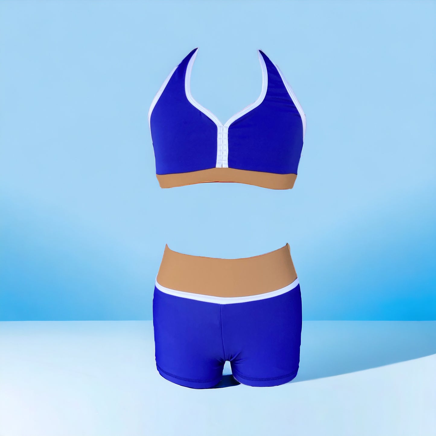 Make a statement with the Amalfi Set from Opra Dancewear! Perfect for dance conventions and auditions, this vibrant set features a unique and sophisticated color block of royal blue, a pop of white, and a neutral cappucino. Stay standing out with this essential set. 