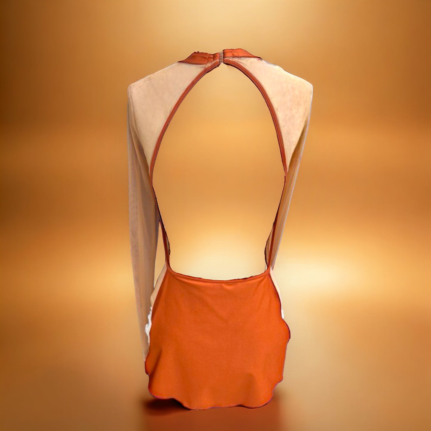 Introducing the Faith Costume Base. Designed with a high neck, long sleeves with a cuff, and a short skirt with high slits, this piece exudes elegance and luxury. Enhance your showstopping look with its unique shark bite and open back design. Versatile and sophisticated, this is a must-have for any costume collection.