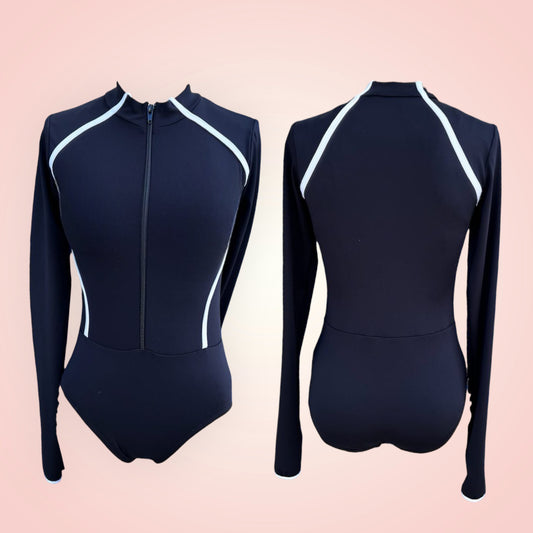 Minimalist yet edgy, the Maddie is a high neck black leo with white detailing to accentuate an hourglass shape. The sleeves are long and extended with the thumbhole.  Wear it to class, wear it on stage, throw on some jeans over it... this is a truly transitional piece that gives us all the v i b e s 