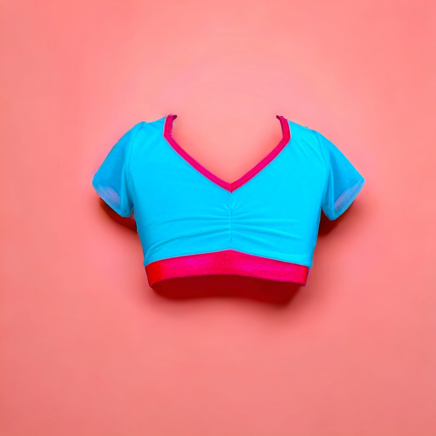 Turquoise top with coral trimming, mesh sleeves, and mesh back, all bringing you back to a retro feeling that is both bold and fun n true Opra fashion. Wear your confidence with Opra Dancewear