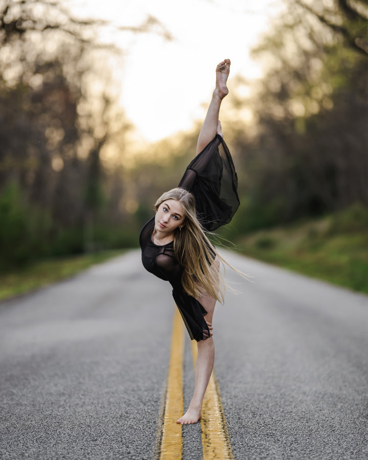  Transform your stage presence with the bell sleeves, curved bodice, and mesh cutouts of The Allonge leotard. Whether it's a solo or group performance, this design exudes flow, dramatic grace, and a bold statement for any dance group, team, or dancer. 