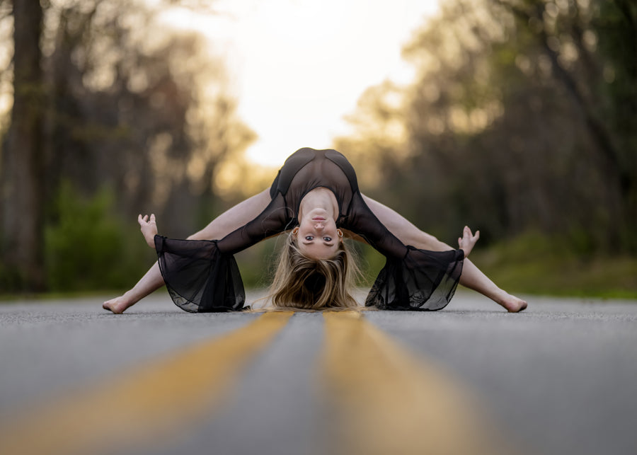  Transform your stage presence with the bell sleeves, curved bodice, and mesh cutouts of The Allonge leotard. Whether it's a solo or group performance, this design exudes flow, dramatic grace, and a bold statement for any dance group, team, or dancer. 